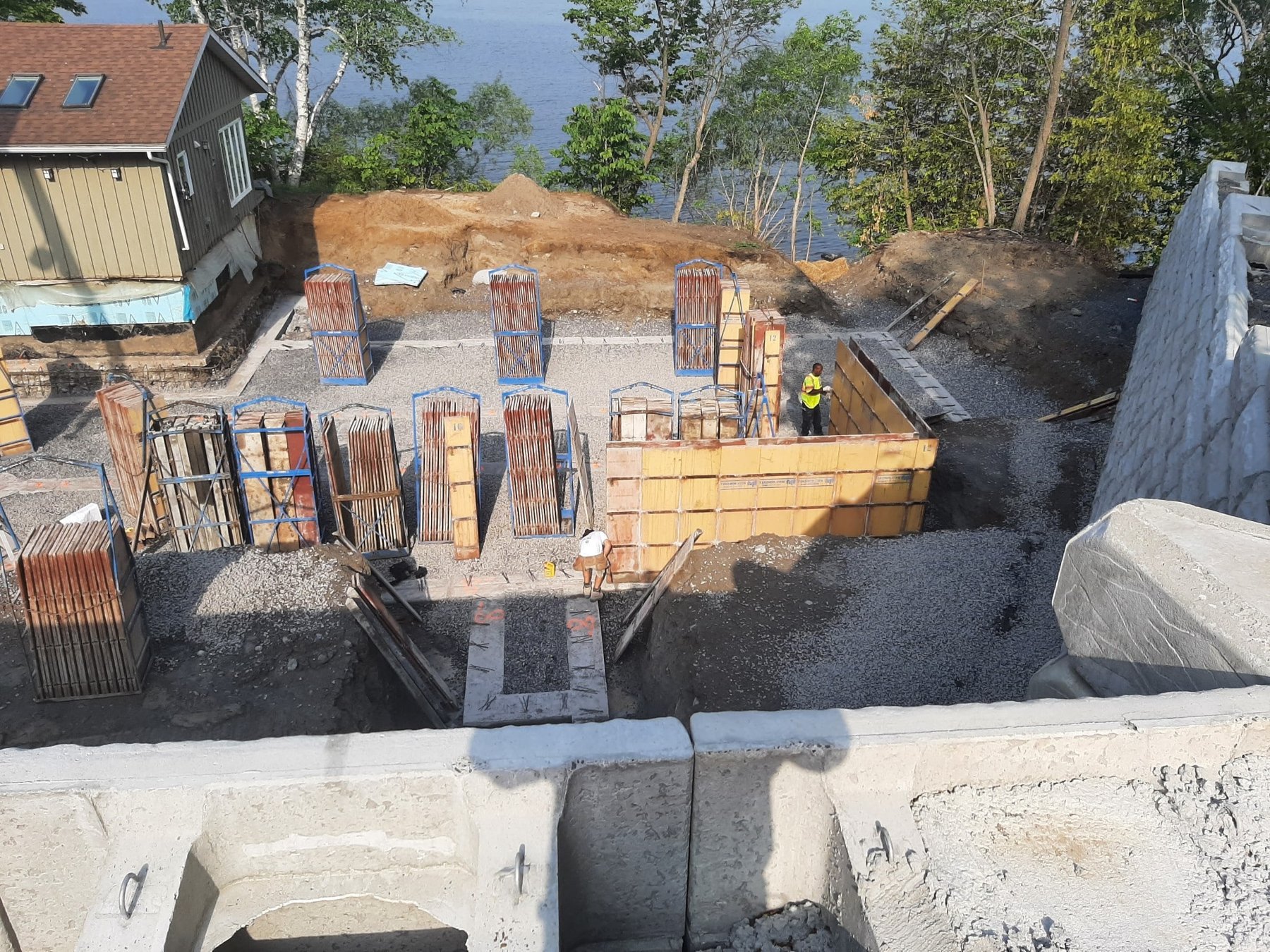 Foundation forming underway near a lakeside property